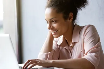 Photo of a female college student using a laptop