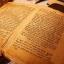 Photo of an open antique book written in Yiddish